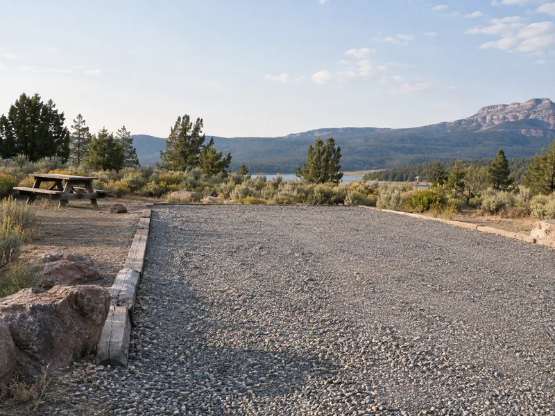 Empty campsite pad with a clear approach and space around a picnic table